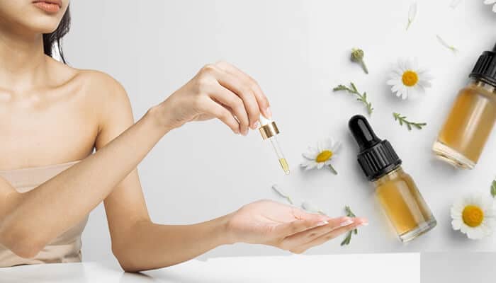 Applying natural oils as part of a routine for how to tighten skin after weight loss naturally, promoting skin elasticity and firmness.