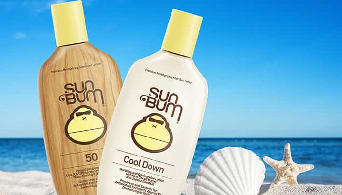 Sun Bum SPF 50 sunscreen and Cool Down after-sun lotion on the beach next to seashells. Is Sun Bum sunscreen safe for post-sun care and hydration?
