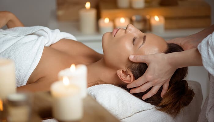 Facial massage therapy shown as a natural remedy for skin firmness in How To Tighten Face Skin Naturally At Home.
