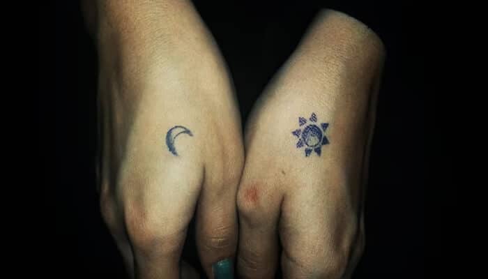 Best Tattoo Designs for Couples - Fashion in beauty - Fashion in Beauty Couple tattoo ideas with sun and moon designs on hands, symbolizing balance and unity.