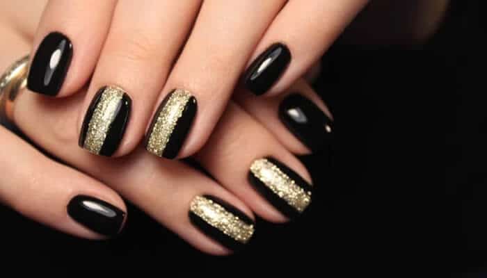 Classic Cat Eye Line - Fashion in beauty - Fashion in Beauty Classic Cat Eye Line design with black and gold nails, perfect for learning how to do cat eye nails at home.