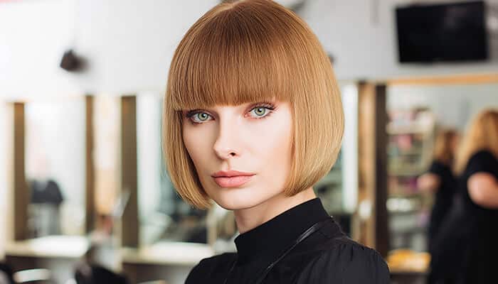 Fringe Curtain Bangs - Fashion in beauty - Fashion in Beauty How to cut curtain bangs demonstrated with fringe curtain bangs, showing bold and dramatic bangs that cover most of the forehead.