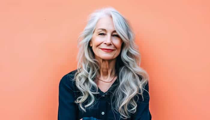 Long Layers with Face-Framing Pieces - Fashion in beauty - Fashion in Beauty Best haircuts for women over 50 - Gorgeous silver waves that embrace age with style.