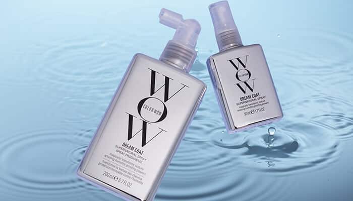 Color Wow Dream Coat Supernatural Spray - Fashion in beauty - Fashion in Beauty WOW Dream Coat anti-frizz sprays shown over water ripples, designed to seal hair and protect from heat, featured as a Best Heat Protectant Spray for sleek results.