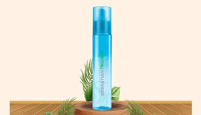 Sebastian Professional Trilliant - Fashion in beauty - Fashion in Beauty Sebastian Trilliant blue spray bottle styled with botanical elements, offering shine enhancement and heat defense, highlighted as a Best Heat Protectant Spray for blow-drying.