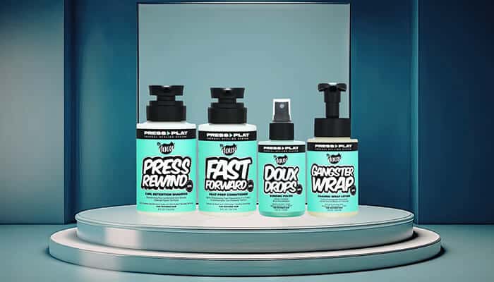 The Doux OPP - Fashion in beauty - Fashion in Beauty Professional styling products arranged on a modern podium, highlighting multi-benefit formulas designed for heat styling, recognized as a Best Heat Protectant Spray option.