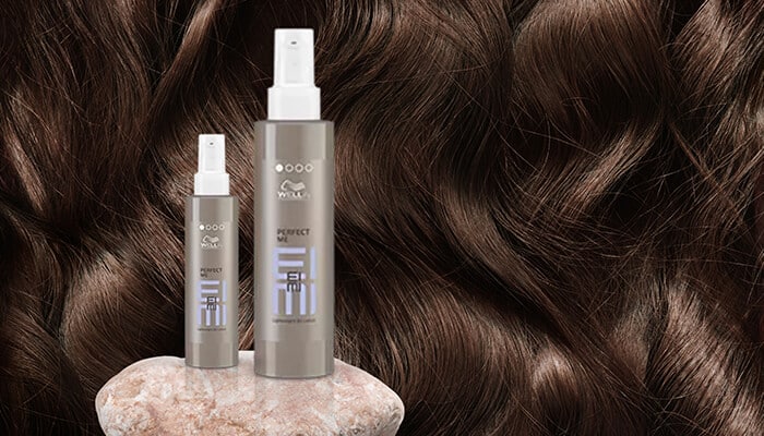 Wella Professionals EIMI Thermal Image Heat Protection Spray - Fashion in beauty - Fashion in Beauty Wella EIMI Perfect Me sprays placed against a textured hair backdrop, delivering smoothing and thermal protection as a Best Heat Protectant Spray for sleek finishes.