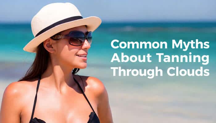 Common Myths About Tanning Through Clouds - Fashion In Beauty - Fashion in Beauty Can You Tan Through Clouds: beach scene showing a woman in sunglasses and sunhat highlighting common myths about tanning through clouds, emphasizing how UVA and UVB rays still penetrate cloud cover and affect skin even on overcast days.