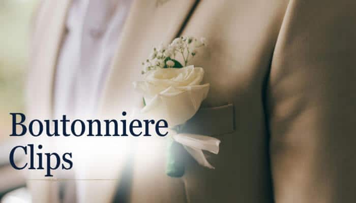 Boutonniere Clips - Fashion In Beauty - Fashion in Beauty Close-up of a white rose boutonniere pinned on a beige suit jacket, demonstrating how to pin a boutonniere correctly for weddings and formal events.