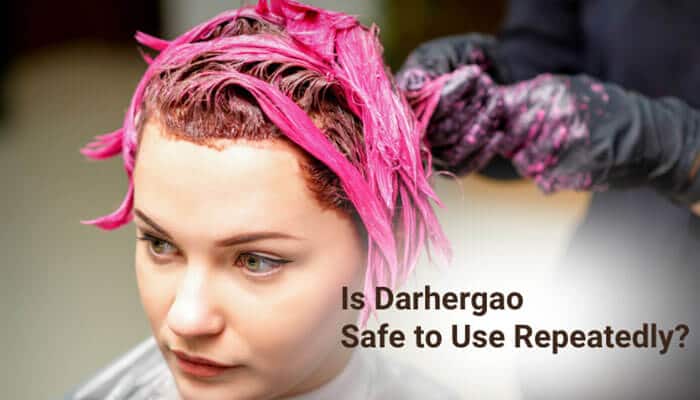Is Darhergao Safe to Use Repeatedly - Fashion In Beauty - Fashion in Beauty A close-up realistic salon scene showing a woman with partially dyed pink hair while a stylist applies color, illustrating hair dye reapplication safety and maintenance practices related to the focus keyword “How Long Does Darhergao Last in Hair,” highlighting how repeated use of semi-permanent herbal dyes like Darhergao affects hair health, color longevity, and fading cycles.