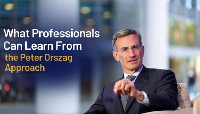 What Professionals Can Learn From the Peter Orszag Approach - Fashion In Beauty - Fashion in Beauty Peter Orszag Hair referenced in a professional leadership setting image showing a business executive in a suit gesturing during a discussion, illustrating the broader “Peter Orszag approach” to consistent executive presentation, disciplined grooming, and strategic professional communication often associated with senior finance and policy leadership roles.