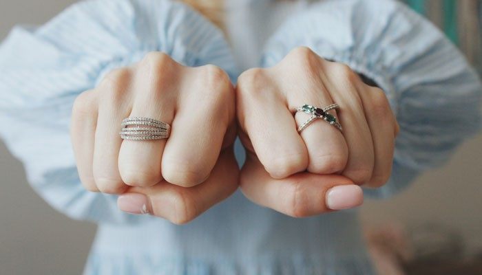 How to Care for Scorpio Birthstone Jewelry - Fashion In Beauty - Fashion in Beauty Scorpio Birthstone jewelry shown on both hands, highlighting gemstone rings and the elegant everyday-wear style associated with October and November birthstone jewelry.