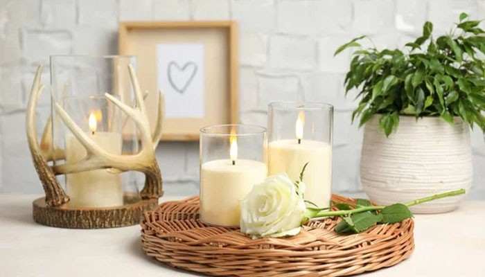 Why the Foton Pearled Candle Works So Well as Home Decor - Fashion In Beauty - Fashion in Beauty Foton Pearled Candle-inspired home decor with glowing candles in clear glass vessels, styled on a woven tray with a white rose, greenery, and rustic accents.